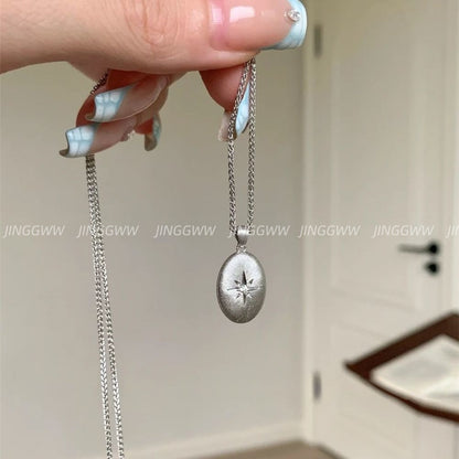 JINGGWW Celestial Guidance Necklace - Polished Oval Pendant with Cubic Zirconia Star